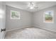 Well-lit bedroom featuring neutral walls and carpet at 104 Robin St, Summerville, SC 29485