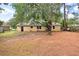 Large backyard with mature trees and ample space at 104 Robin St, Summerville, SC 29485