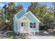 Charming light green house with white trim and a front porch at 2711 Henry St, North Charleston, SC 29405