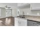 Modern kitchen with white cabinets, granite countertops, and stainless steel appliances at 2711 Henry St, North Charleston, SC 29405