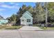 Charming light green house with white trim and a front porch at 2711 Henry St, North Charleston, SC 29405