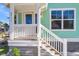 Quaint front porch with white railing and steps leading to the entrance at 2711 Henry St, North Charleston, SC 29405