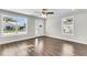 Living room with hardwood floors, large windows, and ceiling fan at 2711 Henry St, North Charleston, SC 29405