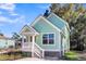Charming light green house with white trim and a front porch at 2711 Henry St, North Charleston, SC 29405