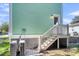 Exterior view of home with light teal siding and white stairs at 2711 Henry St, North Charleston, SC 29405