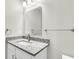 Bathroom features granite countertop, white vanity, and modern fixtures at 2711 Henry St, North Charleston, SC 29405