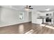 Open living room and kitchen with hardwood floors and modern appliances at 2711 Henry St, North Charleston, SC 29405