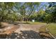 Large backyard with shed and mature trees at 112 Minus St, Saint George, SC 29477