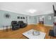 Living Room with hardwood floors and view to dining area at 112 Minus St, Saint George, SC 29477