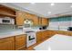Kitchen features light wood cabinets, white countertop, stainless steel appliances, and hardwood floors at 112 Minus St, Saint George, SC 29477