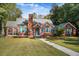 Brick home with blue shutters, landscaped lawn, and walkway at 112 Minus St, Saint George, SC 29477