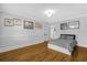 Bright bedroom features hardwood floors, a bed, and framed wall art at 112 Minus St, Saint George, SC 29477