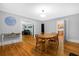 Dining room with hardwood floors and view to kitchen at 112 Minus St, Saint George, SC 29477