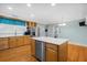 Kitchen with island, stainless steel dishwasher, light wood cabinets, and hardwood floors at 112 Minus St, Saint George, SC 29477