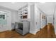 Convenient laundry room with built-in shelving and washer/dryer hookups at 112 Minus St, Saint George, SC 29477