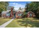 Brick home with blue shutters and well-maintained lawn at 112 Minus St, Saint George, SC 29477