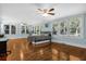 Spacious bedroom with hardwood floors, ceiling fan, and ample natural light at 112 Minus St, Saint George, SC 29477