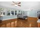 Bright bedroom with hardwood floors, ceiling fan and multiple windows at 112 Minus St, Saint George, SC 29477