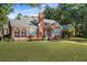Brick house with blue shutters and a landscaped yard at 112 Minus St, Saint George, SC 29477