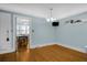 Empty dining room features hardwood floors and view into kitchen area at 112 Minus St, Saint George, SC 29477