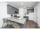 Modern kitchen with gray cabinets and granite countertops at 104 Aplomb Aly # 16, Charleston, SC 29414