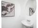 Small bathroom with pedestal sink, round mirror, and framed artwork at 104 Aplomb Aly # 16, Charleston, SC 29414
