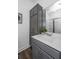 Modern bathroom with gray vanity, white countertop, and a large mirror at 104 Aplomb Aly # 16, Charleston, SC 29414