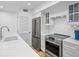 Modern kitchen with stainless steel appliances and white quartz countertops at 1323 Pelican Watch Villas, Seabrook Island, SC 29455