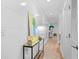 Bright hallway with light wood floors and shiplap walls at 1323 Pelican Watch Villas, Seabrook Island, SC 29455