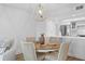 Charming dining area with round table and four chairs, kitchen view at 1323 Pelican Watch Villas, Seabrook Island, SC 29455