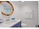 Bathroom with blue vanity, quartz countertop and walk-in shower at 1323 Pelican Watch Villas, Seabrook Island, SC 29455