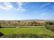 Expansive view of water, beach, and island from grassy area at 1323 Pelican Watch Villas, Seabrook Island, SC 29455