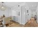 Open kitchen with white cabinets, quartz counters and modern appliances at 1323 Pelican Watch Villas, Seabrook Island, SC 29455