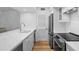 Modern kitchen boasts stainless steel appliances and white shaker cabinets at 1323 Pelican Watch Villas, Seabrook Island, SC 29455