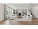 Spacious living room with hardwood floors, fireplace, and large windows at 1694 Cultivation Ln # 542, Mount Pleasant, SC 29466