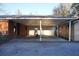 Covered carport with attached storage area at 150 M L King Blvd, Saint Stephen, SC 29479