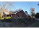 Side view of brick house with chain link fence at 150 M L King Blvd, Saint Stephen, SC 29479