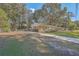 Brick ranch home with a driveway, basketball hoop and large backyard at 1839 Manigault Pl, Charleston, SC 29407