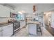 Updated kitchen featuring granite island and white cabinets at 1839 Manigault Pl, Charleston, SC 29407