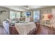 Spacious living room with dark leather sectional sofa and hardwood floors at 1839 Manigault Pl, Charleston, SC 29407