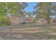 Large backyard with mature trees and a grassy lawn at 1839 Manigault Pl, Charleston, SC 29407