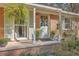 Charming front door and porch with hanging plants and decor at 1839 Manigault Pl, Charleston, SC 29407