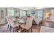 Dining room features a wood table, six chairs, and hardwood floors at 1839 Manigault Pl, Charleston, SC 29407