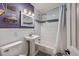 Clean bathroom with pedestal sink and a shower/tub combo at 1839 Manigault Pl, Charleston, SC 29407