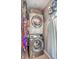Laundry closet with stacked washer and dryer, and ample storage at 1839 Manigault Pl, Charleston, SC 29407