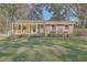 Charming brick ranch house with a large front yard and mature trees at 1839 Manigault Pl, Charleston, SC 29407
