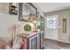 Inviting entryway with rustic cabinet, mirror, and fall decor at 1839 Manigault Pl, Charleston, SC 29407