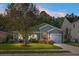 Gray house with a two-car garage and well-manicured lawn at 476 Rockville Rd, Moncks Corner, SC 29461