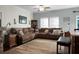 Open living room with sectional sofa and access to backyard at 476 Rockville Rd, Moncks Corner, SC 29461