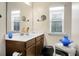 Bathroom with vanity, mirror, and window with blinds at 476 Rockville Rd, Moncks Corner, SC 29461